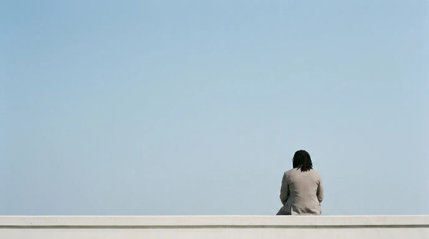 KF sitting on a white ledge under an open sky